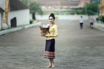 Asian woman in silk dress in temple
