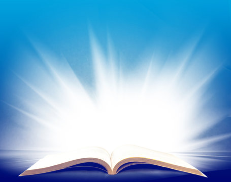 image of open book with a beautiful light closeup