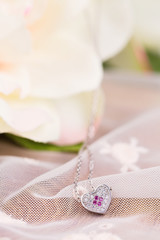 Silver necklace with pink gem