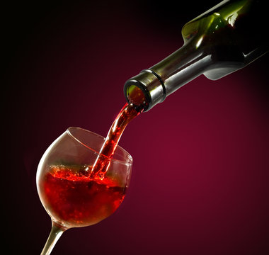 Isolated image of bottle and glass with wine close-up