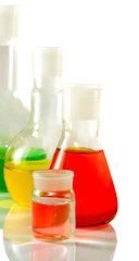 microscope and flasks with liquid in laboratory closeup