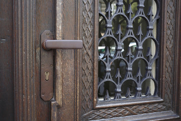 Rustic wooden door with iron handle.