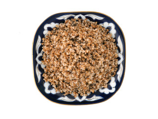 Beautiful dish with buckwheat on a white background. View from above