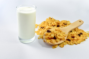 Cornflakes with currant  in a wooden spoon