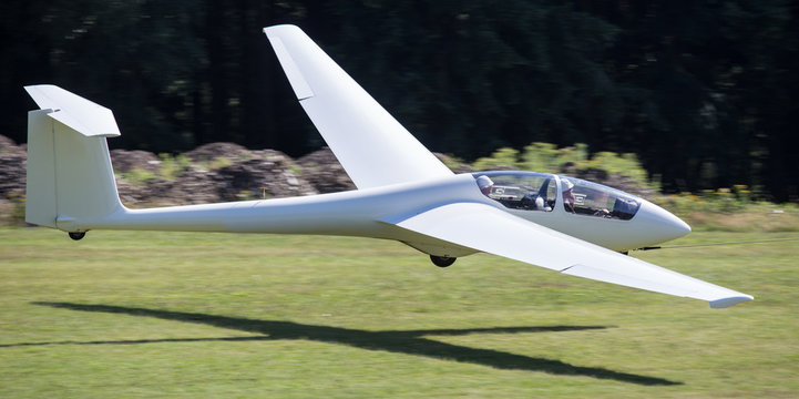 sailplane with towing rope starting on an airfield