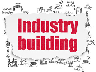 Manufacuring concept: Industry Building on Torn Paper background