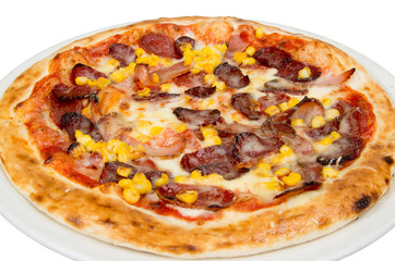 Pizza on a white background with tomato sauce, cheese, sausage, tenderloin and corn.