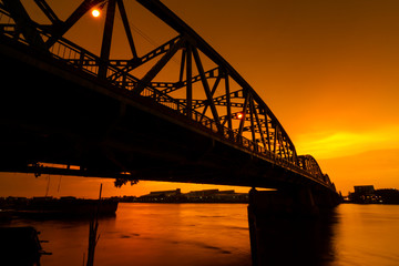 Fototapeta na wymiar Steel Bridge sunset Thailand