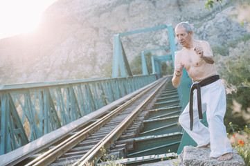 Older man practicing martial arts
