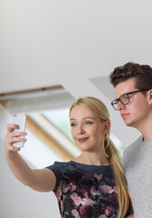 Close-up of friends using their phones and having fun together.