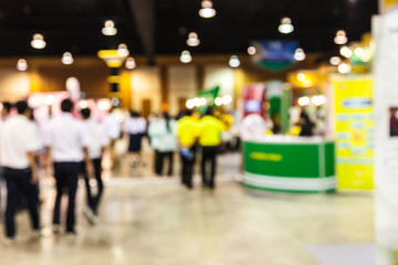 people walking in exhibition blurred