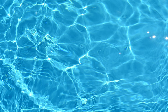 Water surface with a blue ripples