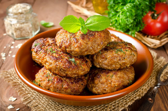 Juicy delicious cutlets with oatmeal. Rustic style