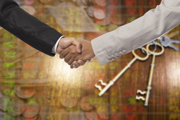 Handshake of businessmen on blur business background