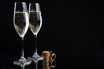 glasses of champagne on a black background 