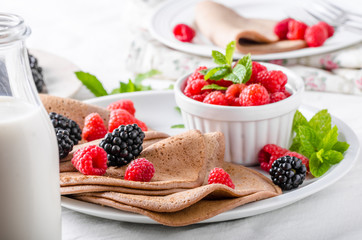 Cocoa pancakes with forest fruit