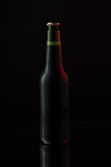 Beer in a bottle on a dark background 