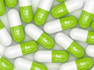 Selenium pills lying on white table