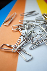 Metal clips on colored paper