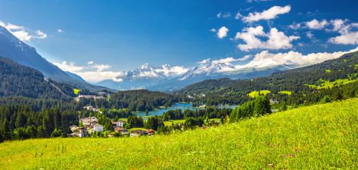 Fototapeta na wymiar Panorama View to Lenzerheide village with Haidisee, Arose Rothorn and Swiss Alps. Lenzerheide is a mountain resort in canton Graubunden, Switzerland. 