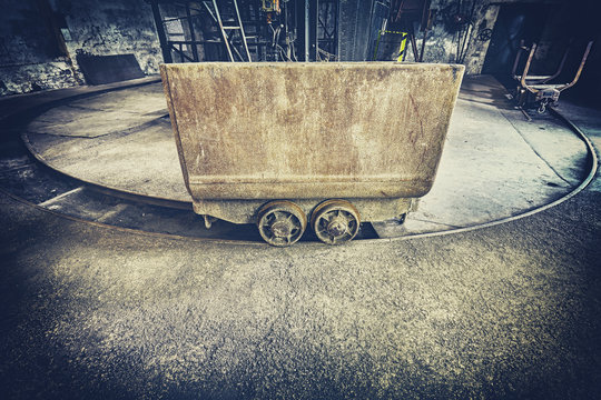 Retro Toned Old Rusty Mine Cart, Obsolete Mining Equipment.