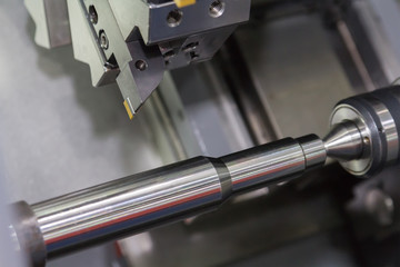 Steel metal cutting machine process by CNC lathe in workshop
