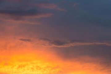 Naklejka na ściany i meble Abstract beautiful sunrise and dramatic clouds on the sky.
