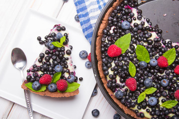 Delicious tart with blueberries and raspberries