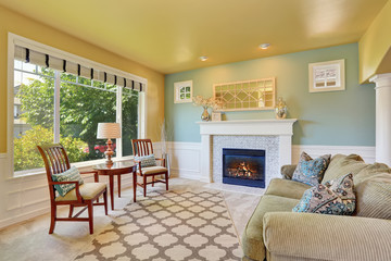 Elegant living room interior with yellow ceiling