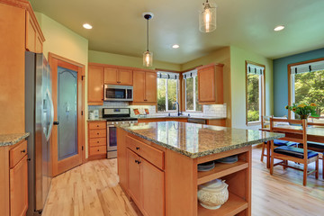 Light brown storage combination in large kitchen room