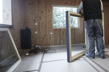 Worker installing new window