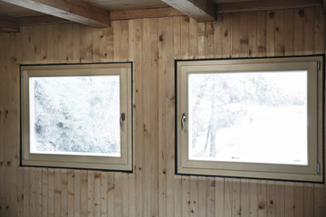 New efficient windows installed in wooden house