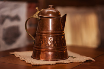 Antique copper jug in old Rhodope house near Belintash sanctuary, Bulgaria