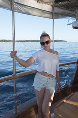 beautiful sexy woman posing on a boat