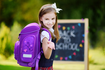 Adorable little girl feeling excited about going back to school