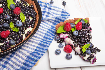 Delicious tart with blueberries and raspberries