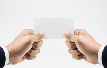 Closeup hand wearing white shirt showing blank paper card 