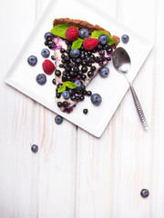 Naklejka na ściany i meble Delicious tart with blueberries and raspberries
