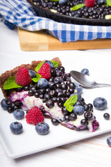 Delicious tart with blueberries and raspberries