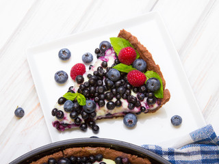 Delicious tart with blueberries and raspberries