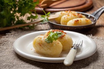 Potato dumplings stuffed with minced meat.