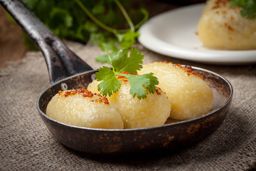 Potato dumplings stuffed with minced meat.
