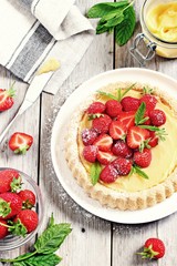 Strawberry tart with lemon cream and mint .Selective focus 