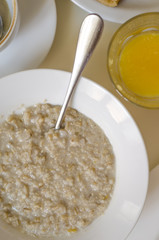 Oatmeal pancakes fresh orange juice coffee and scrambled eggs for breakfast  