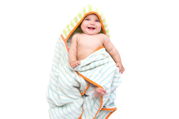 Adorable baby, looking out under in towel
