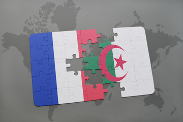 puzzle with the national flag of france and algeria on a world map background.