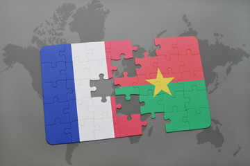 puzzle with the national flag of france and burkina faso on a world map background.