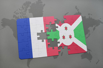 puzzle with the national flag of france and burundi on a world map background.