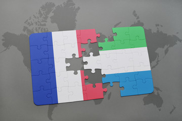 puzzle with the national flag of france and sierra leone on a world map background.
