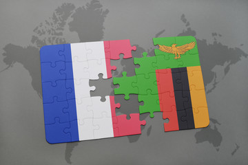 puzzle with the national flag of france and zambia on a world map background.